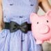 lady in stripped dress with piggy bank