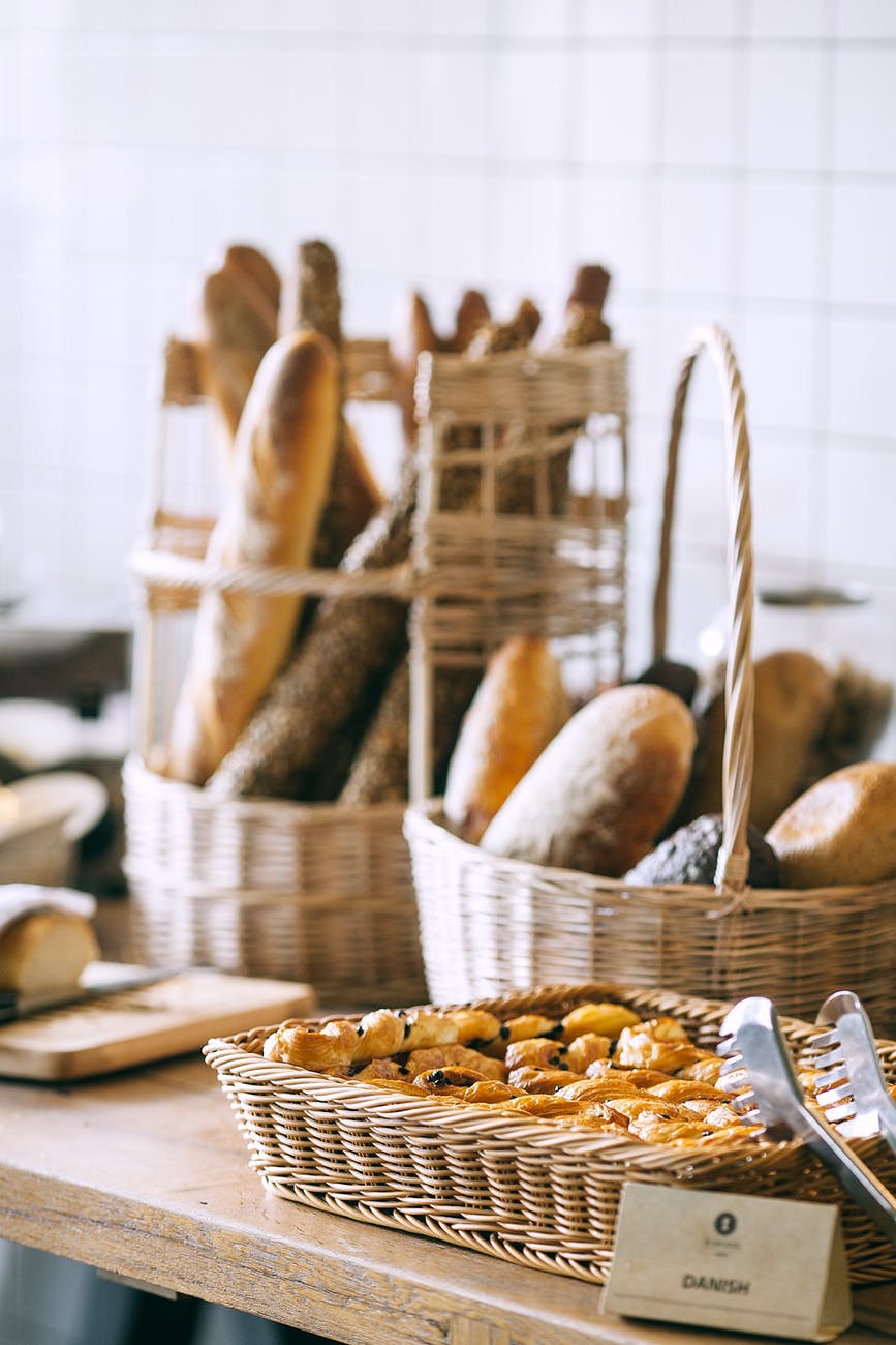 delicious baked bread and buns in baskets